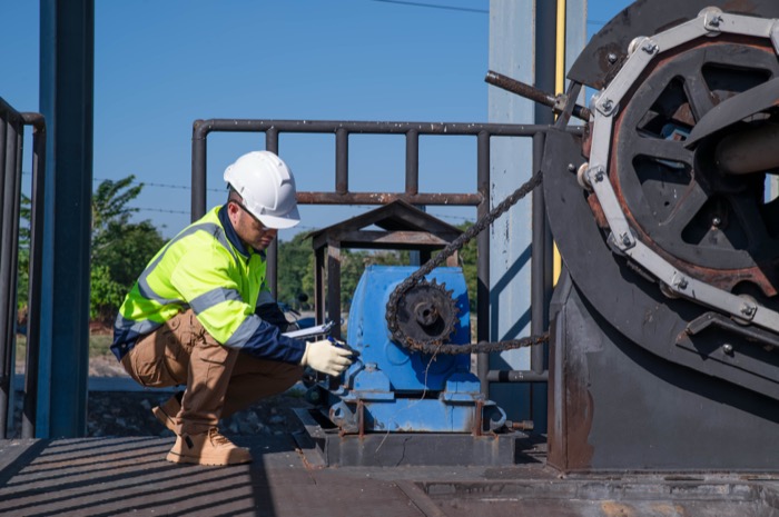 Technician servicing municipal water treatment equipment